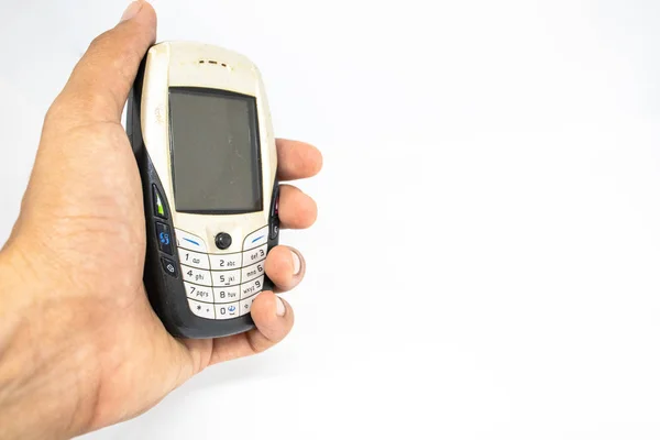 Finger Holding Old Generation Mobile Phone White Isolate Die Cut — Stock Photo, Image