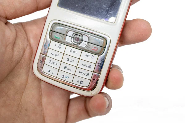 Finger Holding Old Generation Mobile Phone White Isolate Die Cut — Stock Photo, Image