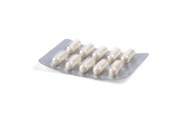 Beyaz Arka Plan Üzerinde Izole Kapsül Paketi Içinde Ilaç — Stok fotoğraf