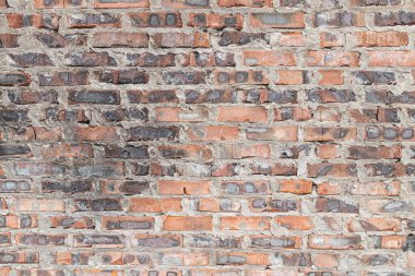 Eski yanmış kırmızı tuğla. Duvar üstüne duvar. Eski bir tuğlanın dokusu.