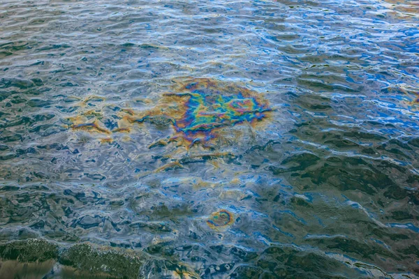 Oil slick on water surface. Oil from U.S.S. Arizona battleship at Pearl Harbor.
