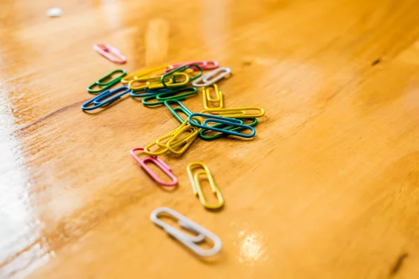paper clips on a wood table.organize the office.