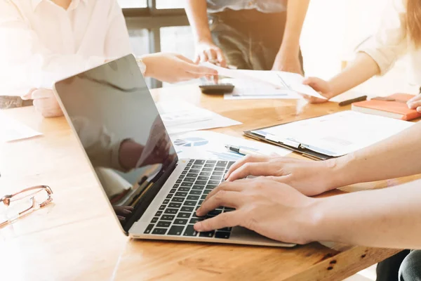 Business people hand typing on the keyboard in office, Business People present marketing strategies plan in workspace, Business Concept.