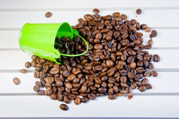 Grains Coffee Poured Green Decorative Bucket Lie White Wooden Table — Stock Photo, Image