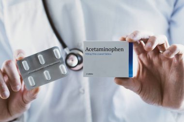 Doctor holding Acetaminophen drug