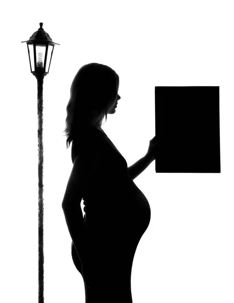 妊娠中の女性、白い背景にシルエット — ストック写真