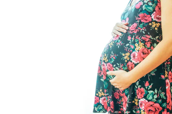 Menina grávida em um fundo branco — Fotografia de Stock