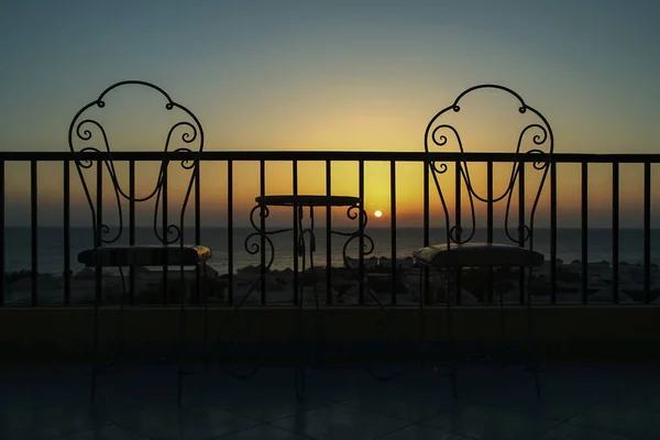 Very beautiful silhouette of chairs on the seashore of the sea — Stock Photo, Image