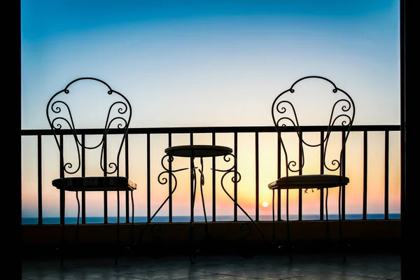 Very beautiful silhouette of chairs on the seashore of the sea — Stock Photo, Image
