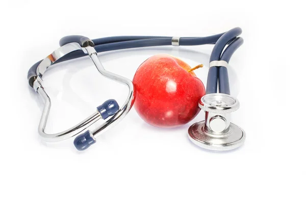 Statoscope κομψό γιατρό με ένα μήλο σε λευκό φόντο — Φωτογραφία Αρχείου