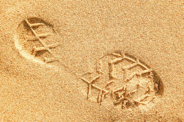 Vackra fotspår i sanden natur bakgrund — Stockfoto