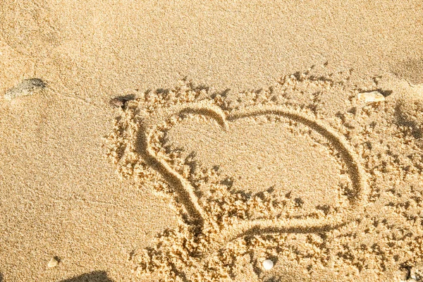 Beautiful drawing on the sand of the sea background — Stock Photo, Image