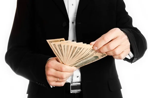Hombre de negocios sosteniendo dinero sobre fondo blanco — Foto de Stock