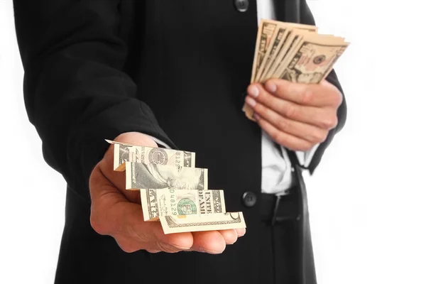 Business man holding money on white background — Stock Photo, Image