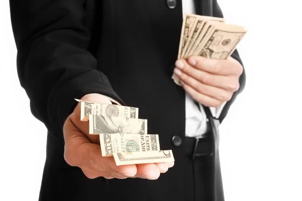 Business man holding money on white background — Stock Photo, Image