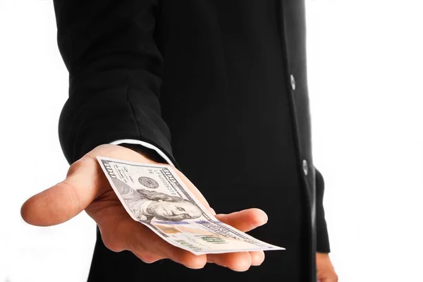 Επιχειρηματίας κρατώντας χρήματα σε λευκό φόντο — Φωτογραφία Αρχείου