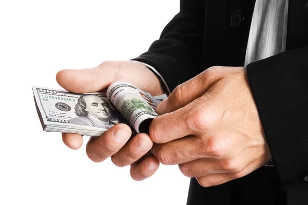 Uomo d'affari in possesso di denaro su sfondo bianco — Foto Stock