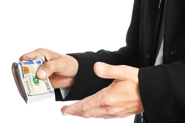 Hombre de negocios sosteniendo dinero sobre fondo blanco — Foto de Stock