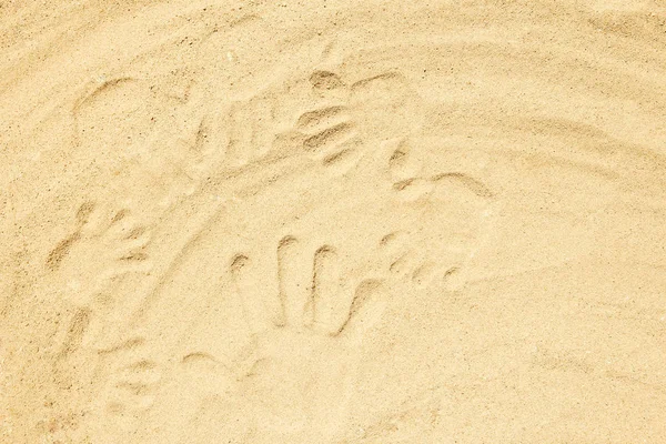 Bellissimo disegno sulla sabbia dello sfondo del mare — Foto Stock