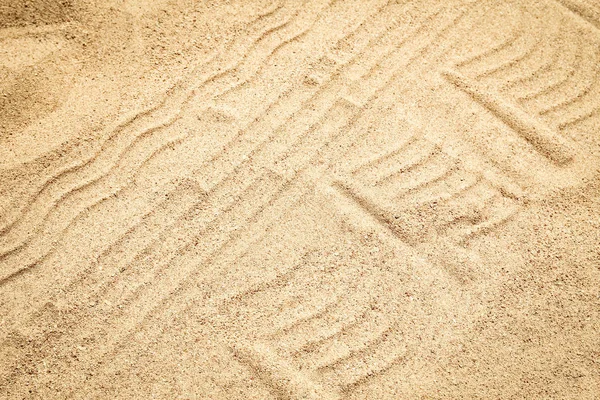바다 배경의 모래 위의 아름다운 그림 — 스톡 사진