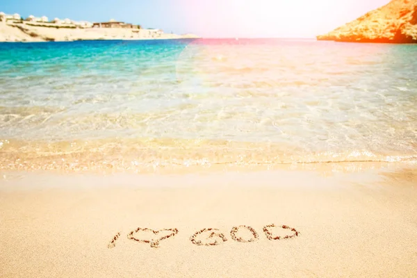 Beautiful drawing on the sand of the sea background — Stock Photo, Image