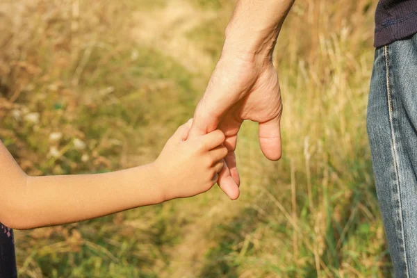 Beautiful hands outdoors in a park — Stock Photo, Image