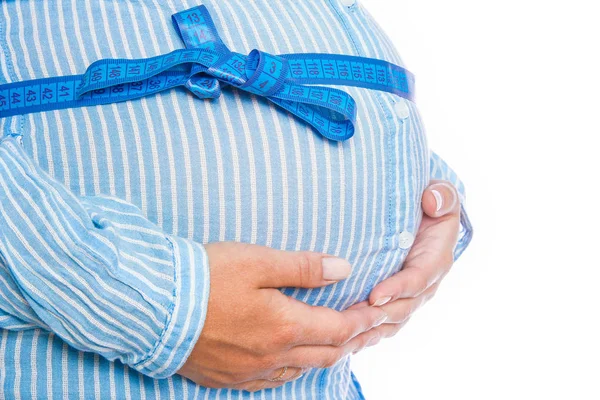 Happy pregnant girl lies on white background — Stock Photo, Image