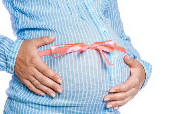 Happy pregnant girl lies on white background — Stock Photo, Image