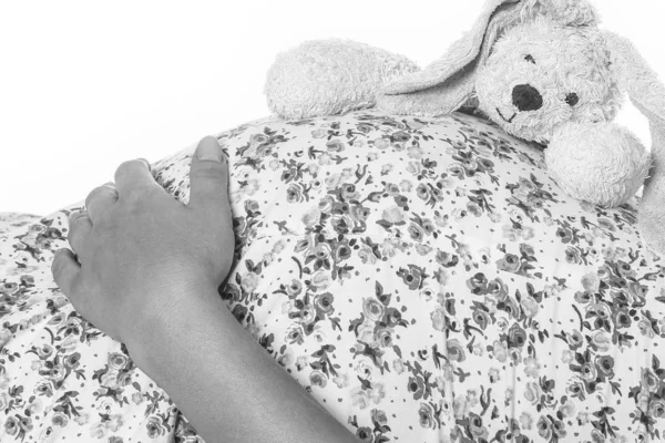 Feliz embarazada se encuentra sobre fondo blanco —  Fotos de Stock