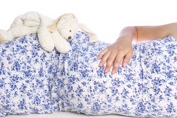 Happy pregnant girl lies on white background — Stock Photo, Image