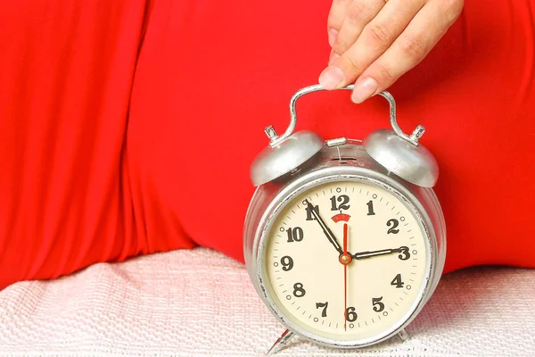 Happy pregnant girl lies on white background — Stock Photo, Image