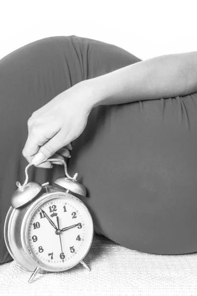 Happy pregnant girl lies on white background — Stock Photo, Image