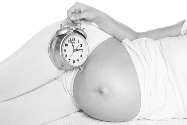 Happy pregnant girl lies on white background — Stock Photo, Image