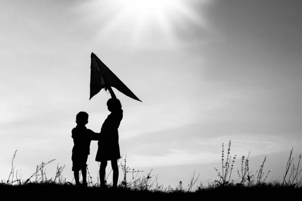 Happy children playing on nature summer silhouette — Stock Photo, Image