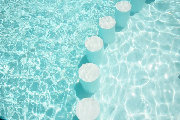 Beautiful swimming pool at the seaside hotel in park background — Stock Photo, Image