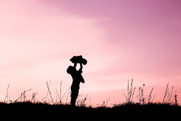 Happy children playing on nature summer silhouette — Stock Photo, Image