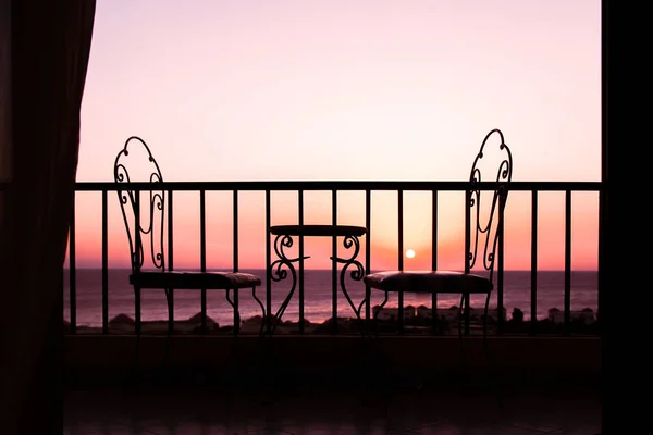 Very nice silhouette of chairs on the seashore sea background — Stock Photo, Image