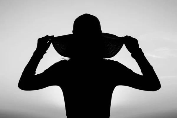 Silhouette of a girl on a chair on a nature background — Stock Photo, Image