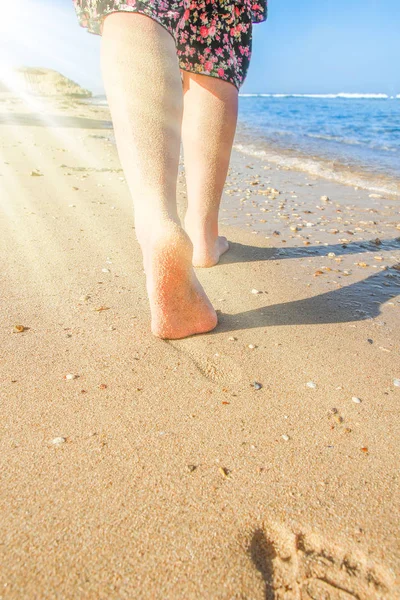 Beautiful traces with feet on sea nature background