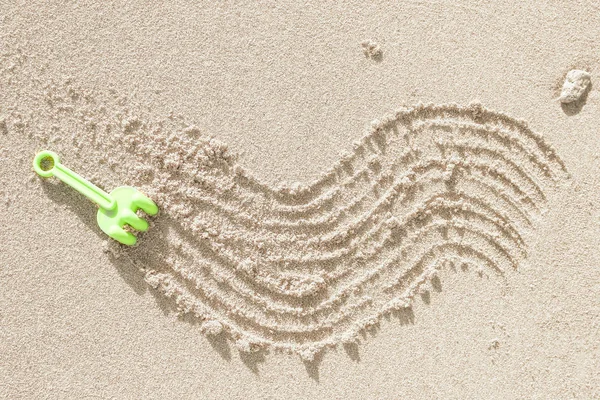 Belo desenho na areia do fundo do mar — Fotografia de Stock