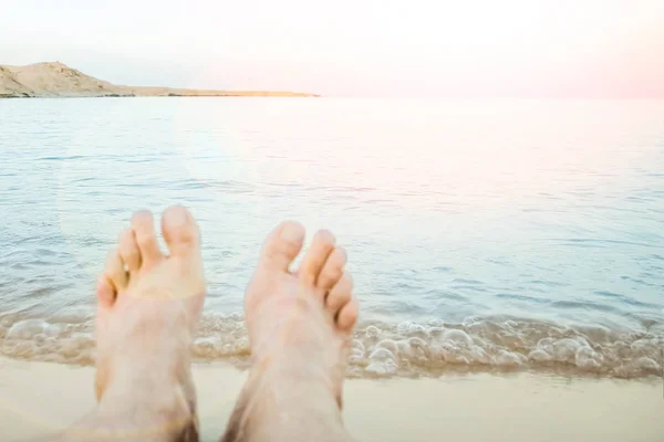 Beautiful traces with feet on sea nature background