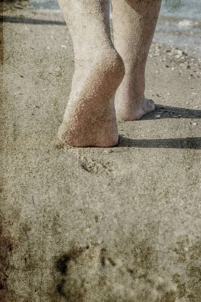 Old photo of beautiful traces with feet on the background of the — Stock Photo, Image