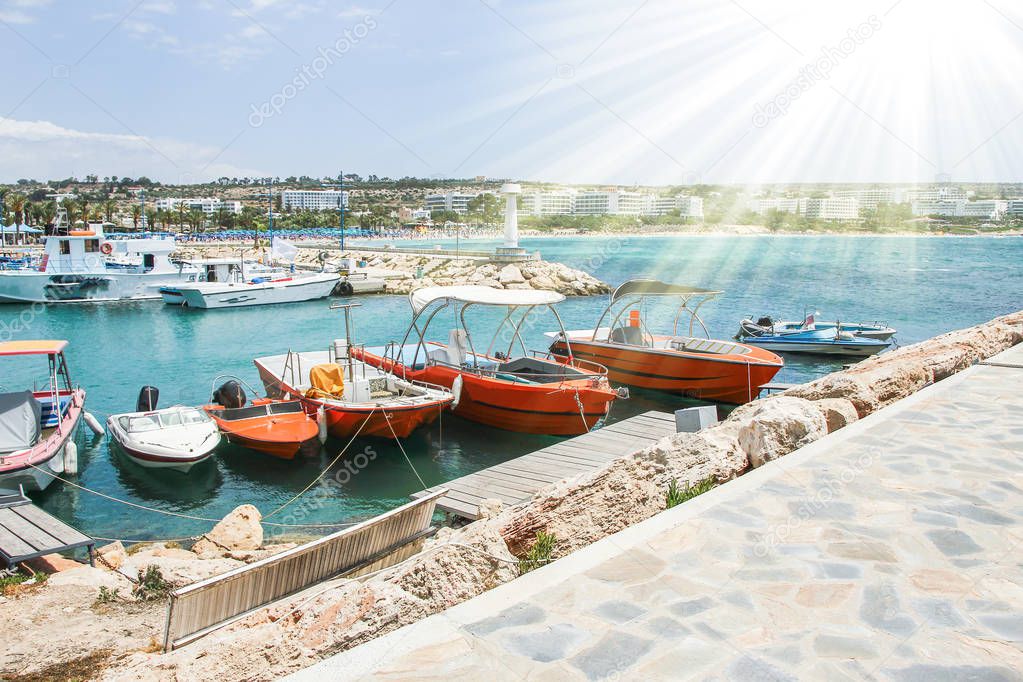 pier with boats and yachts on the nature of the sea shore