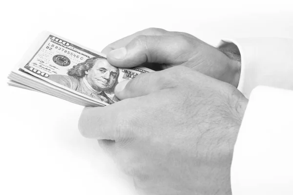 Üzleti pénz dollár a kezében egy fehér háttér — Stock Fotó