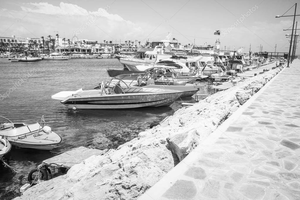 pier with boats and yachts on the nature of the sea shore