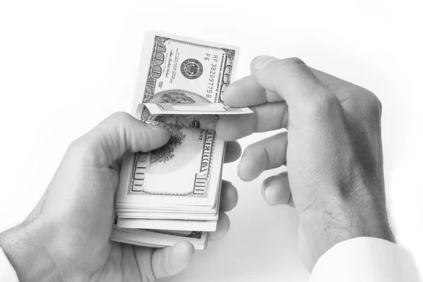 Dinheiro de negócios dólares nas mãos em um fundo branco — Fotografia de Stock