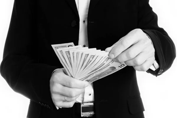 Hombre de negocios sosteniendo dinero sobre fondo blanco — Foto de Stock