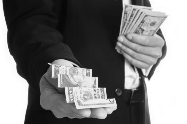 Business man holding money on white background — Stock Photo, Image