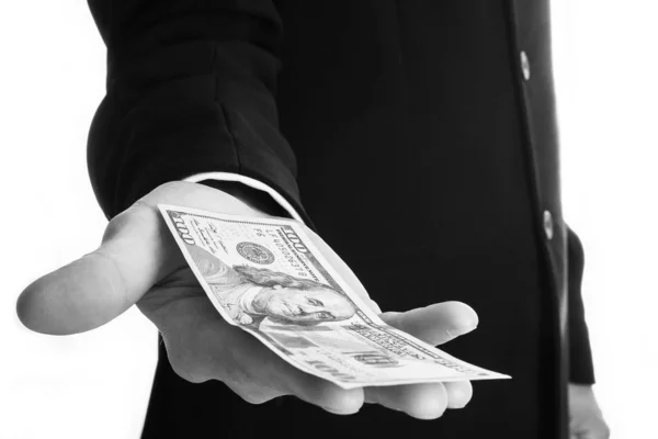 Hombre de negocios sosteniendo dinero sobre fondo blanco —  Fotos de Stock