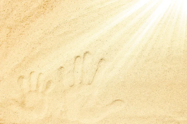 Prachtige tekening op het zand van de zee achtergrond — Stockfoto